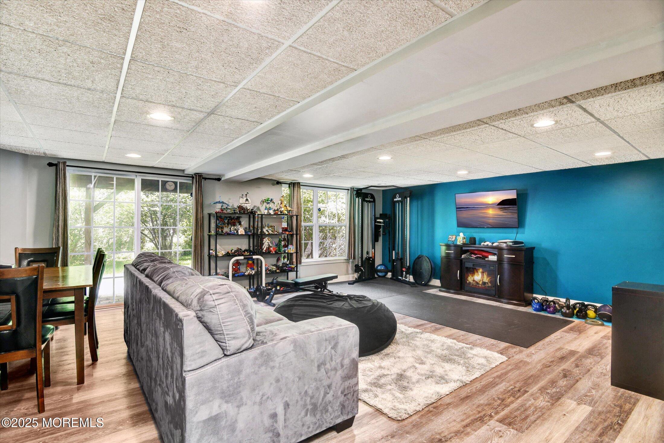 45 Brookfield Drive Jackson, NJ 08527 - Photo 30 of 39 a living room with furniture and a flat screen tv