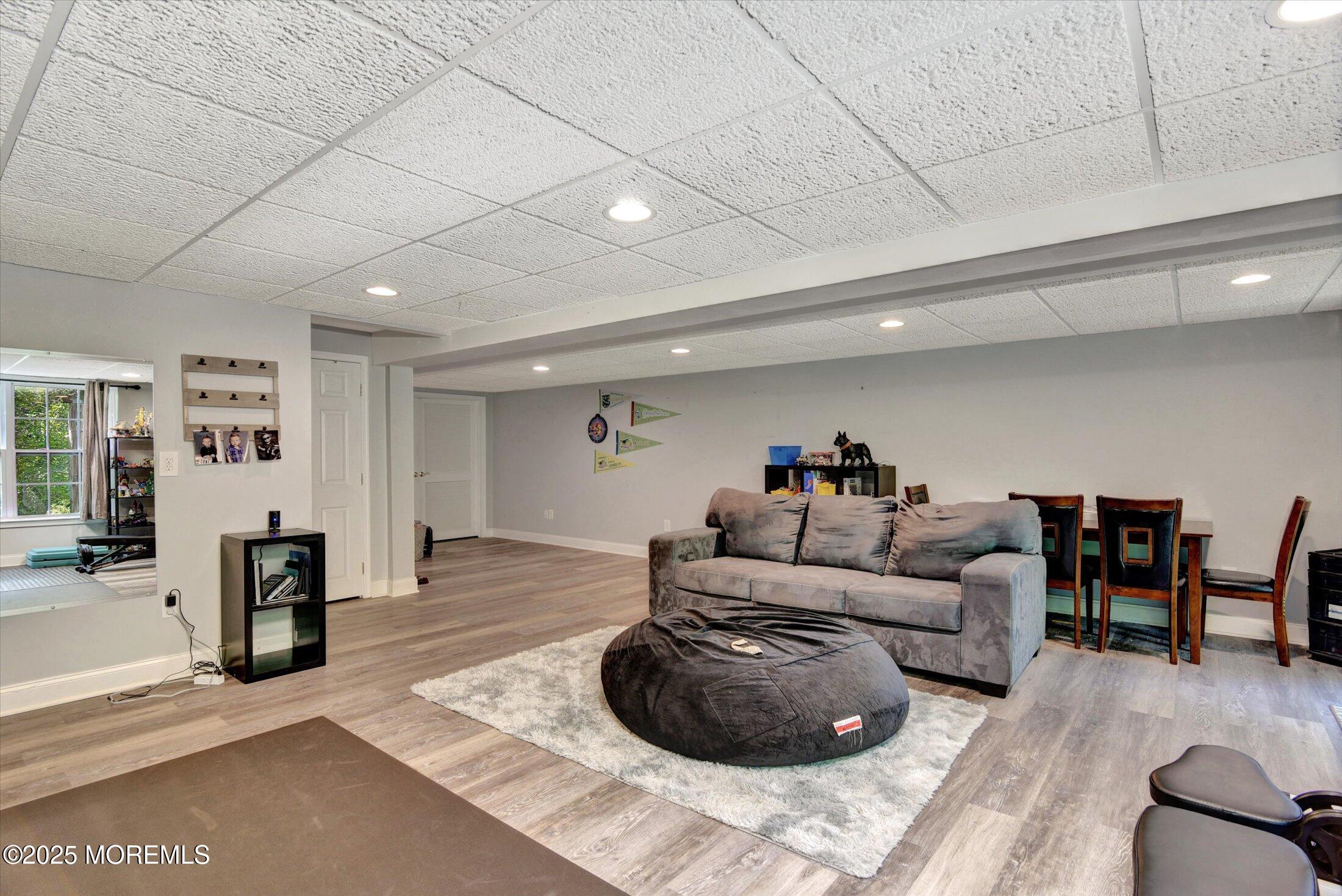 45 Brookfield Drive Jackson, NJ 08527 - Photo 32 of 39 a living room with furniture and a wooden floor
