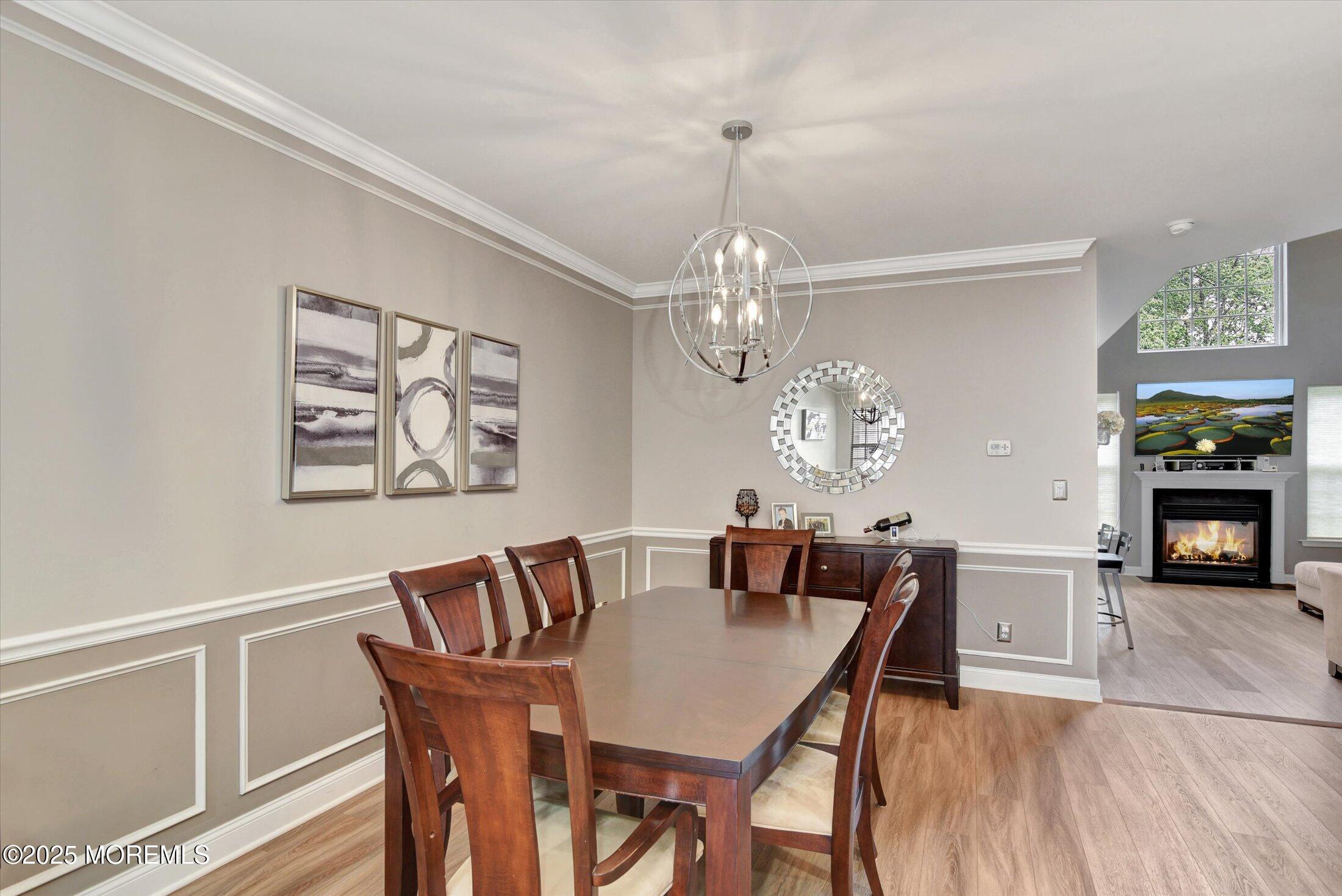 45 Brookfield Drive Jackson, NJ 08527 - Photo 10 of 39 a view of a dining room with furniture a chandelier and wooden floor