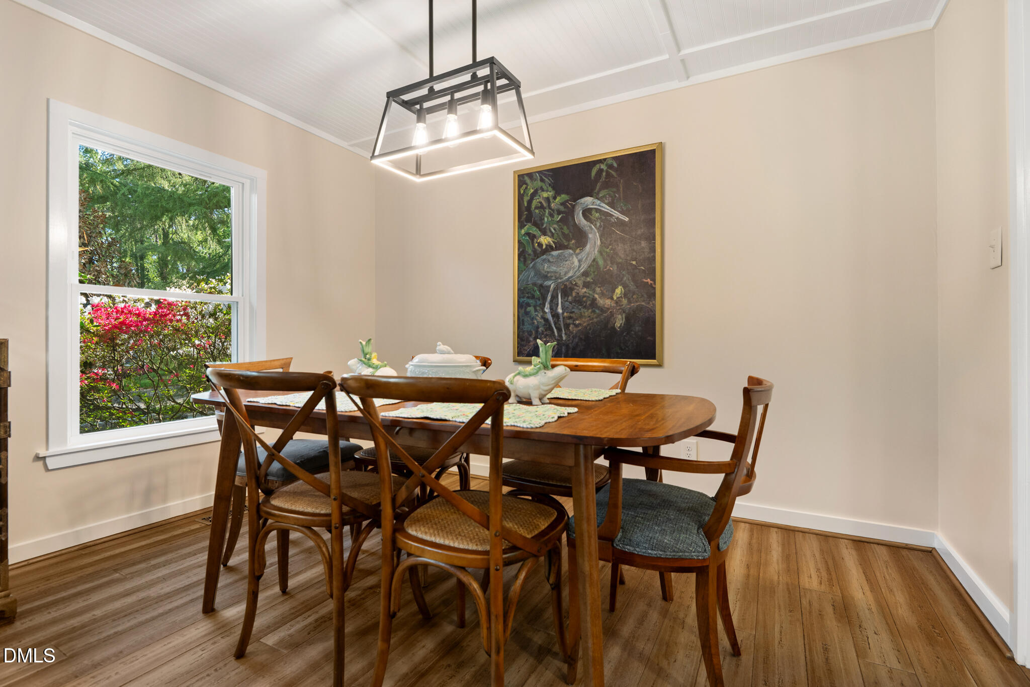 1902 White Plains Road Chapel Hill, NC 27517 - Photo 16 of 53 a view of a dining room with furniture window and wooden floor