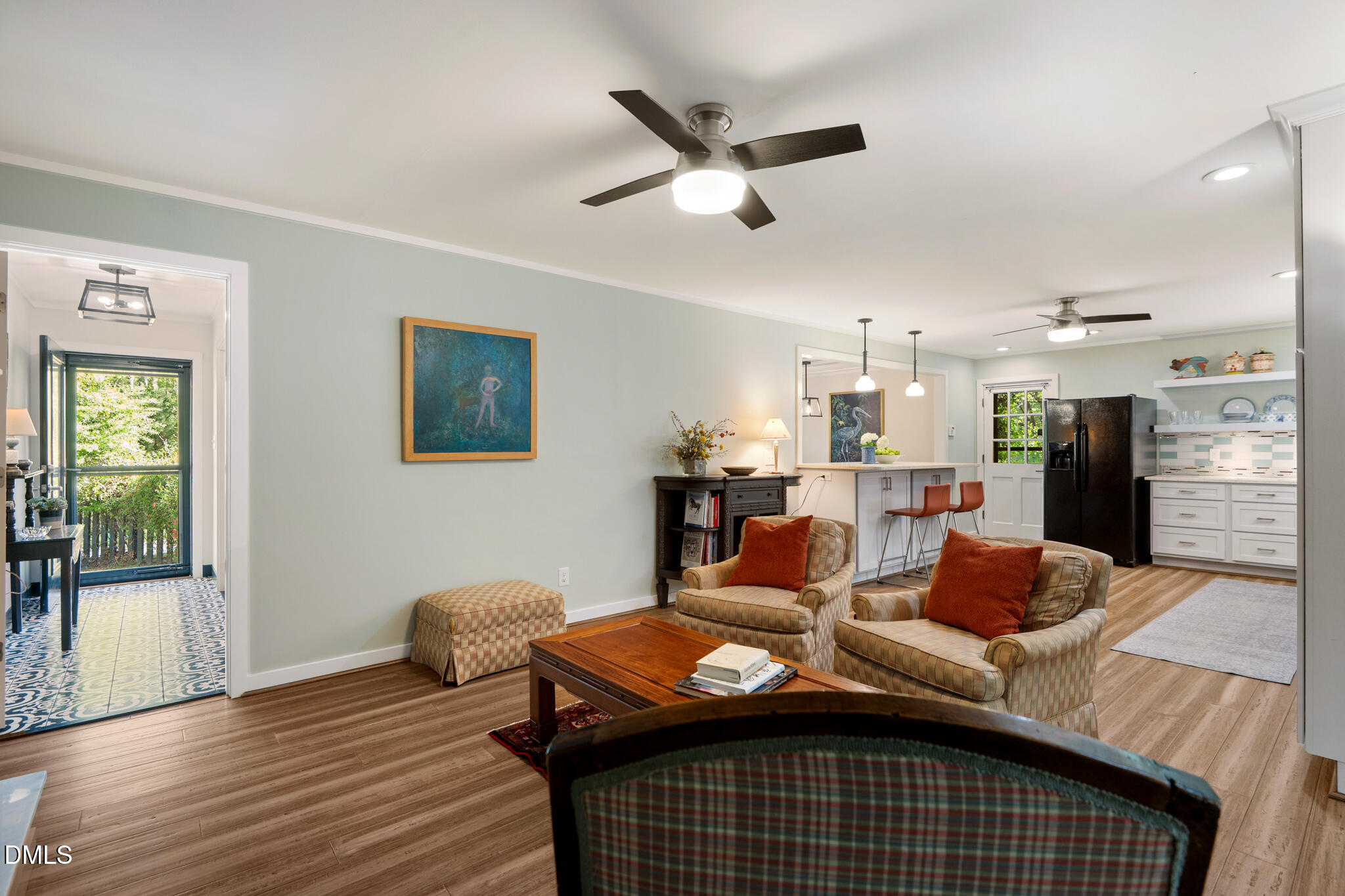 1902 White Plains Road Chapel Hill, NC 27517 - Photo 20 of 53 a living room with furniture kitchen view and a wooden floor