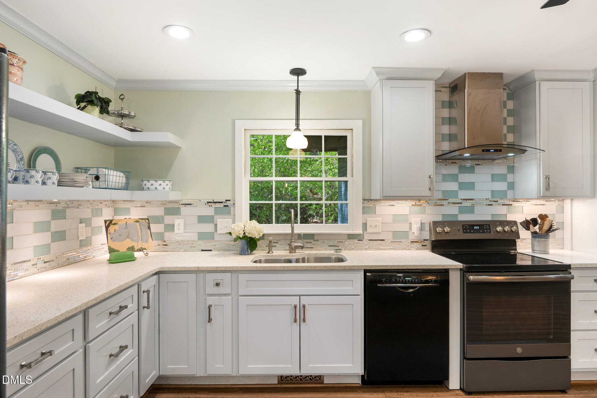 1902 White Plains Road Chapel Hill, NC 27517 - Photo 23 of 53 a kitchen with granite countertop a sink stainless steel appliances and cabinets