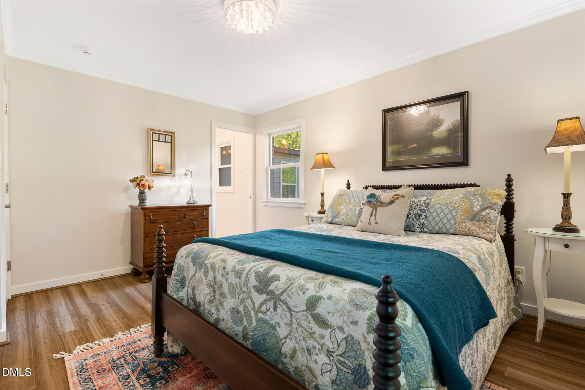 1902 White Plains Road Chapel Hill, NC 27517 - Photo 29 of 53 a bedroom with a bed and wooden floor