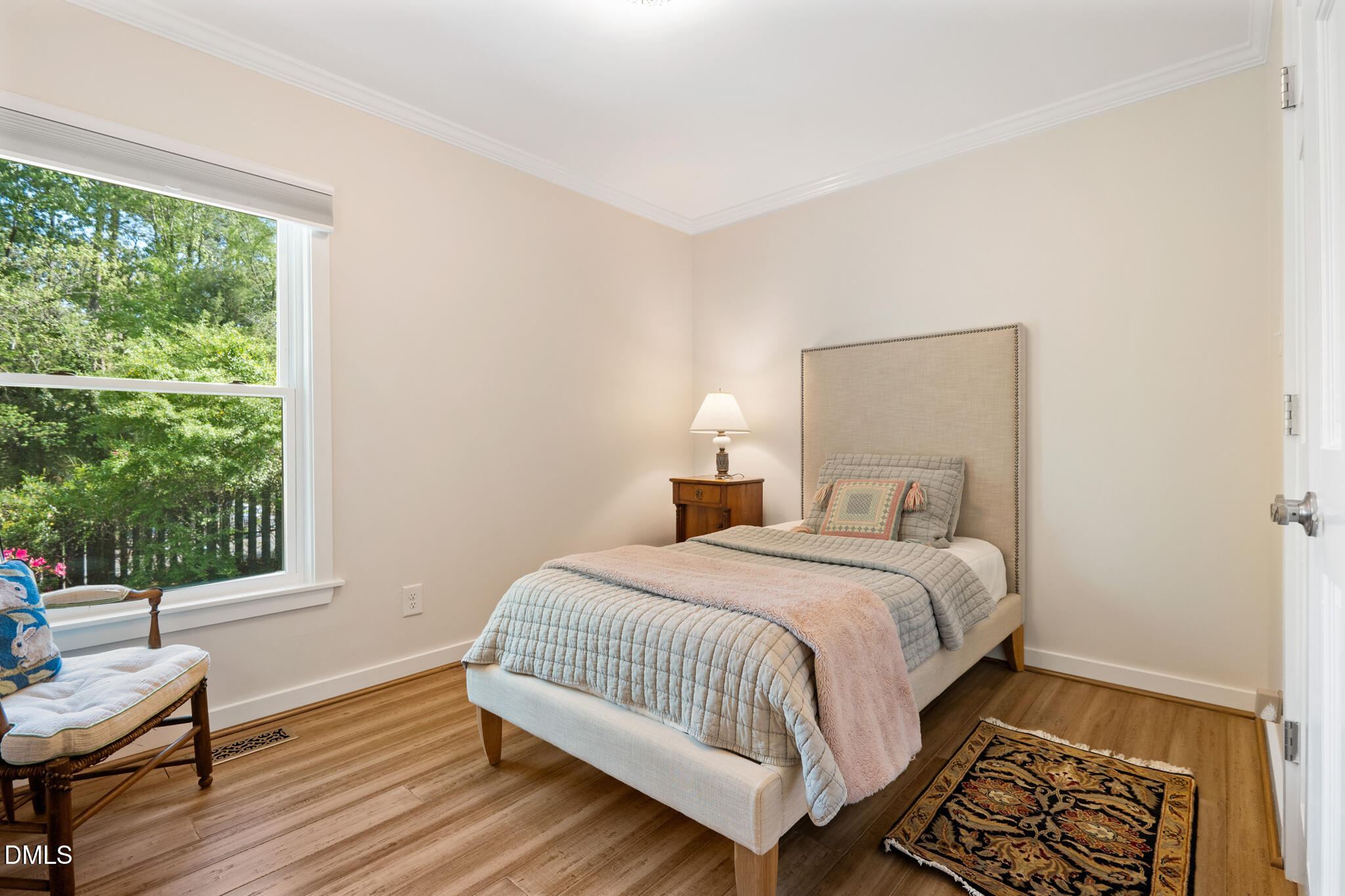 1902 White Plains Road Chapel Hill, NC 27517 - Photo 33 of 53 a bedroom with a bed and wooden floor