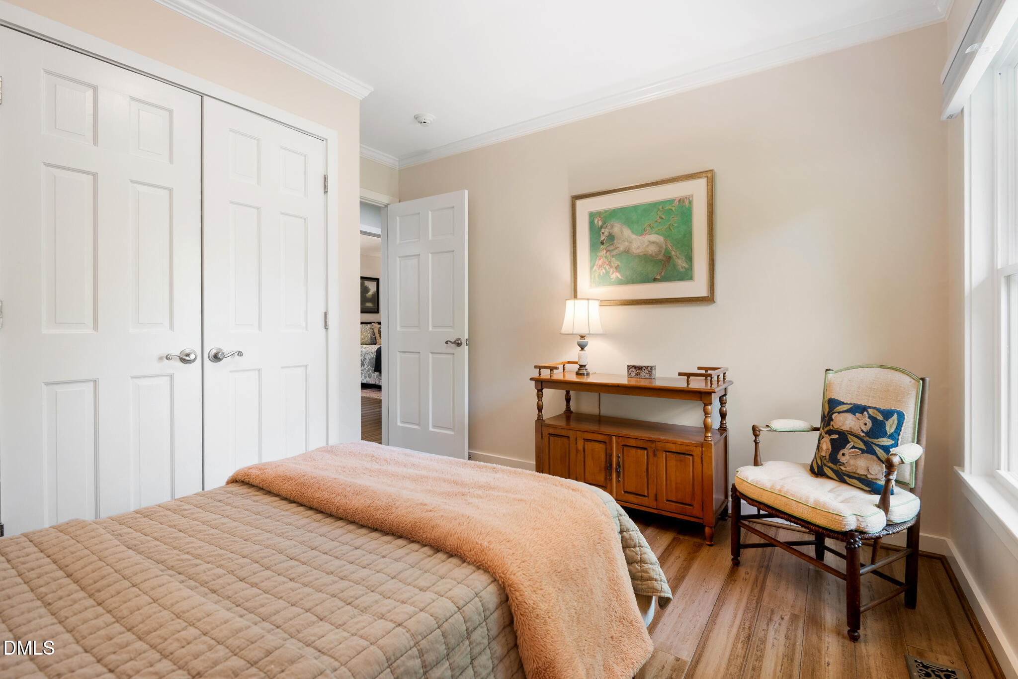 1902 White Plains Road Chapel Hill, NC 27517 - Photo 34 of 53 a bedroom with a bed and wooden floor