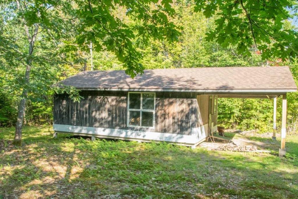 69 Harlin Road Garland, ME 04939 - Photo 5 of 14 Exterior side of camp