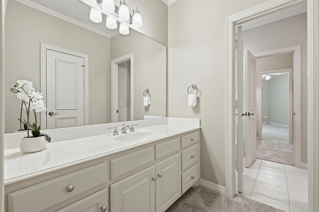970 Crystal Cove Oak Point, TX 75068 - Photo 29 of 40 a bathroom with a sink a vanity and a mirror
