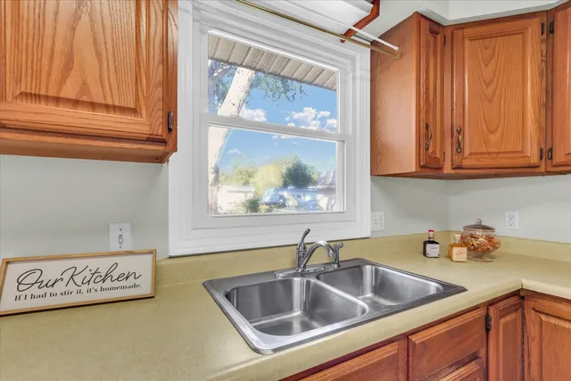 a kitchen with a sink and cabinets