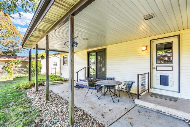a house view with a outdoor seating space