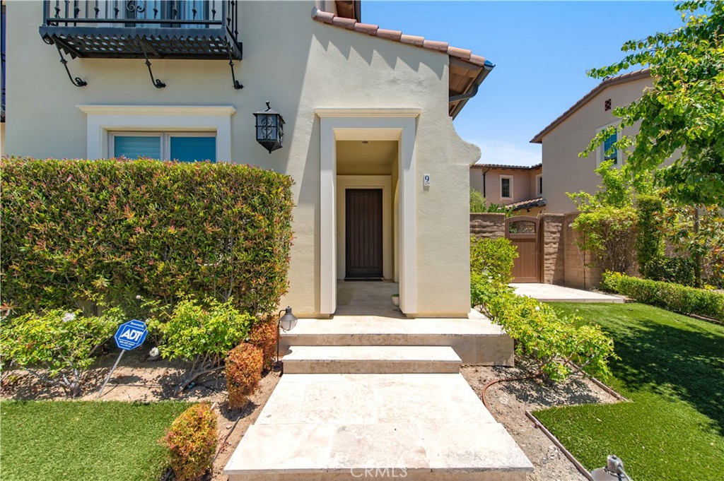 9 Shadybend Irvine, CA 92602 - Photo 3 of 5 a front view of a house with a yard