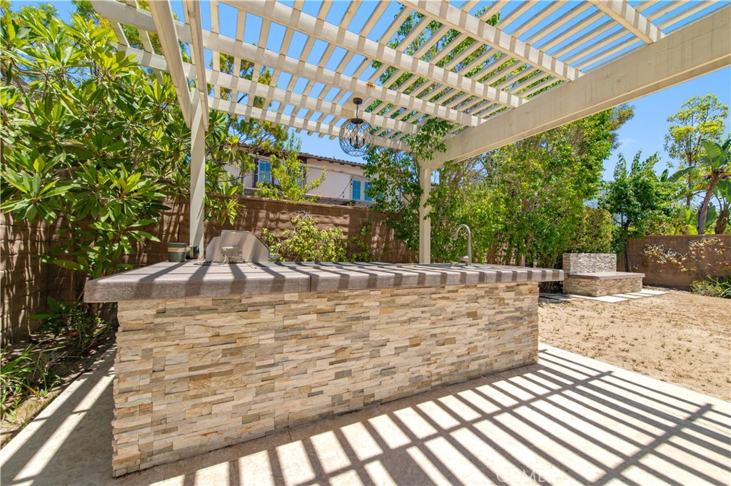 9 Shadybend Irvine, CA 92602 - Photo 4 of 5 a view of a swimming pool with a patio
