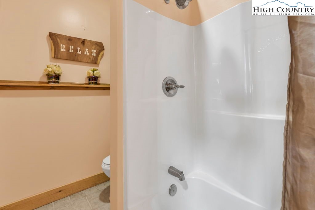 173 Spring Brook Road Newland, NC 28657 - Photo 32 of 39 a bathroom with a shower
