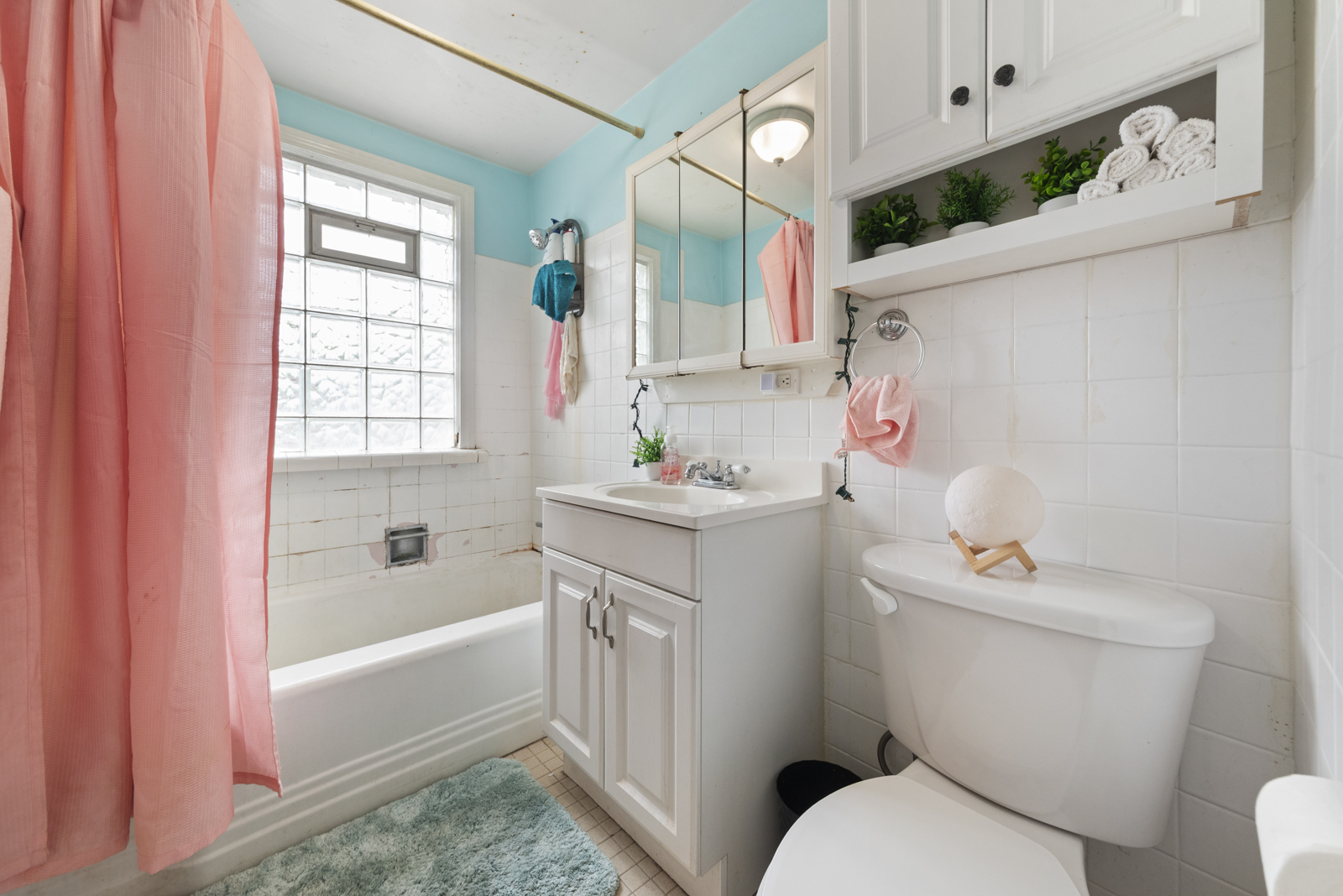 11030 Austin Avenue Chicago Ridge, IL 60415 - Photo 13 of 17 a white bath tub sitting next to a white toilet and sink