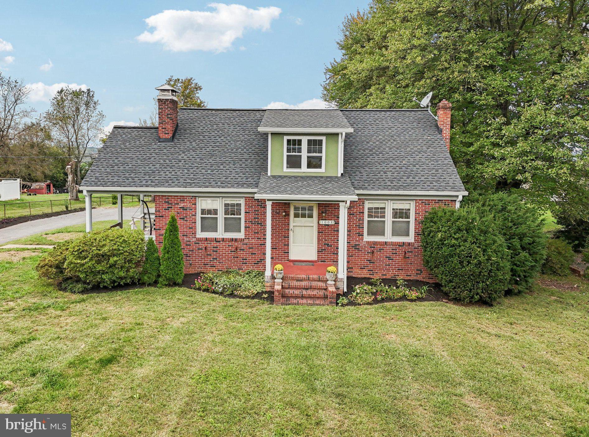 1008 North Main Street Mount Airy, MD 21771 - Photo 1 of 52 a front view of a house with a yard