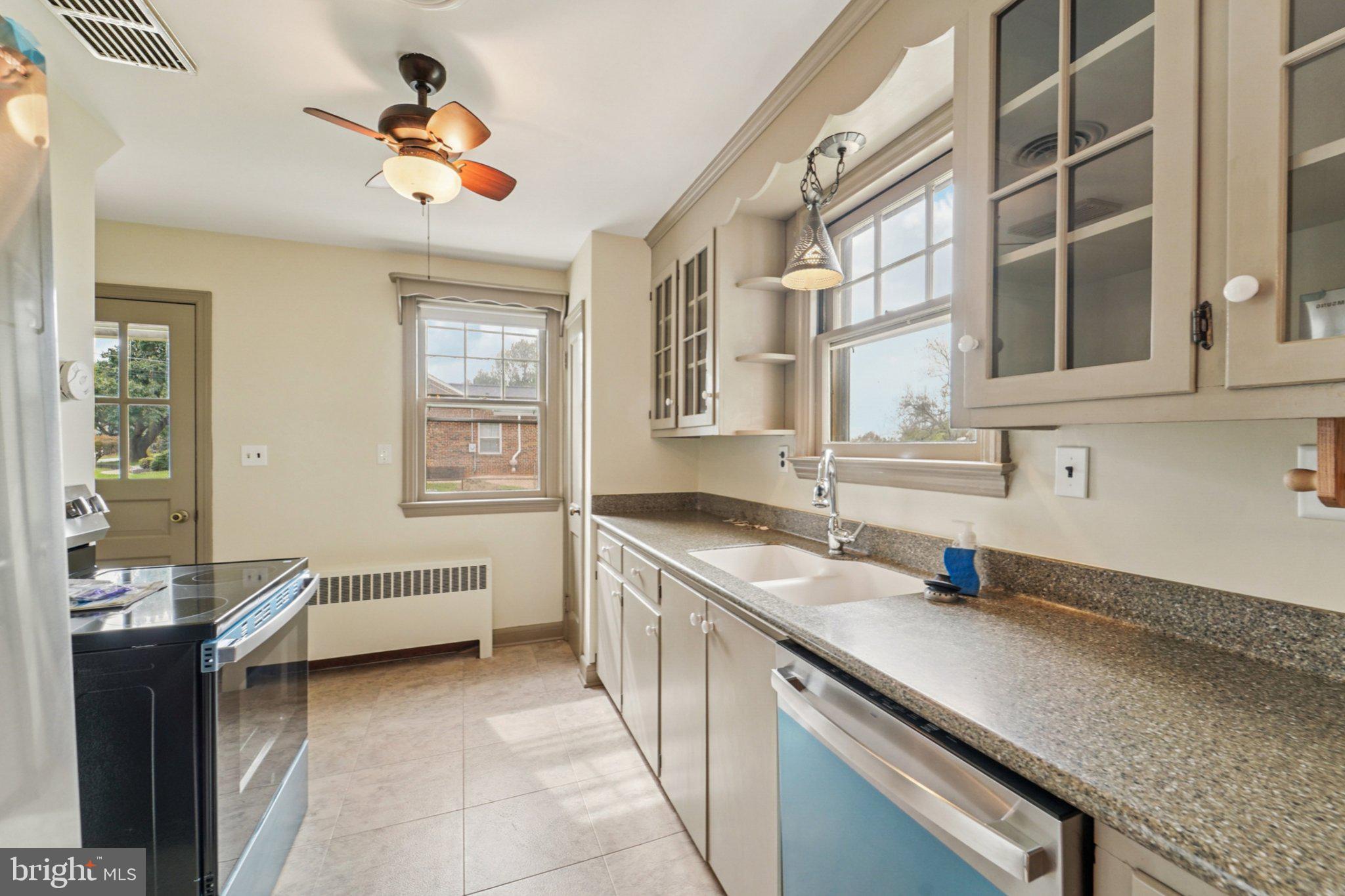 1008 North Main Street Mount Airy, MD 21771 - Photo 12 of 52 a kitchen with a sink and a stove