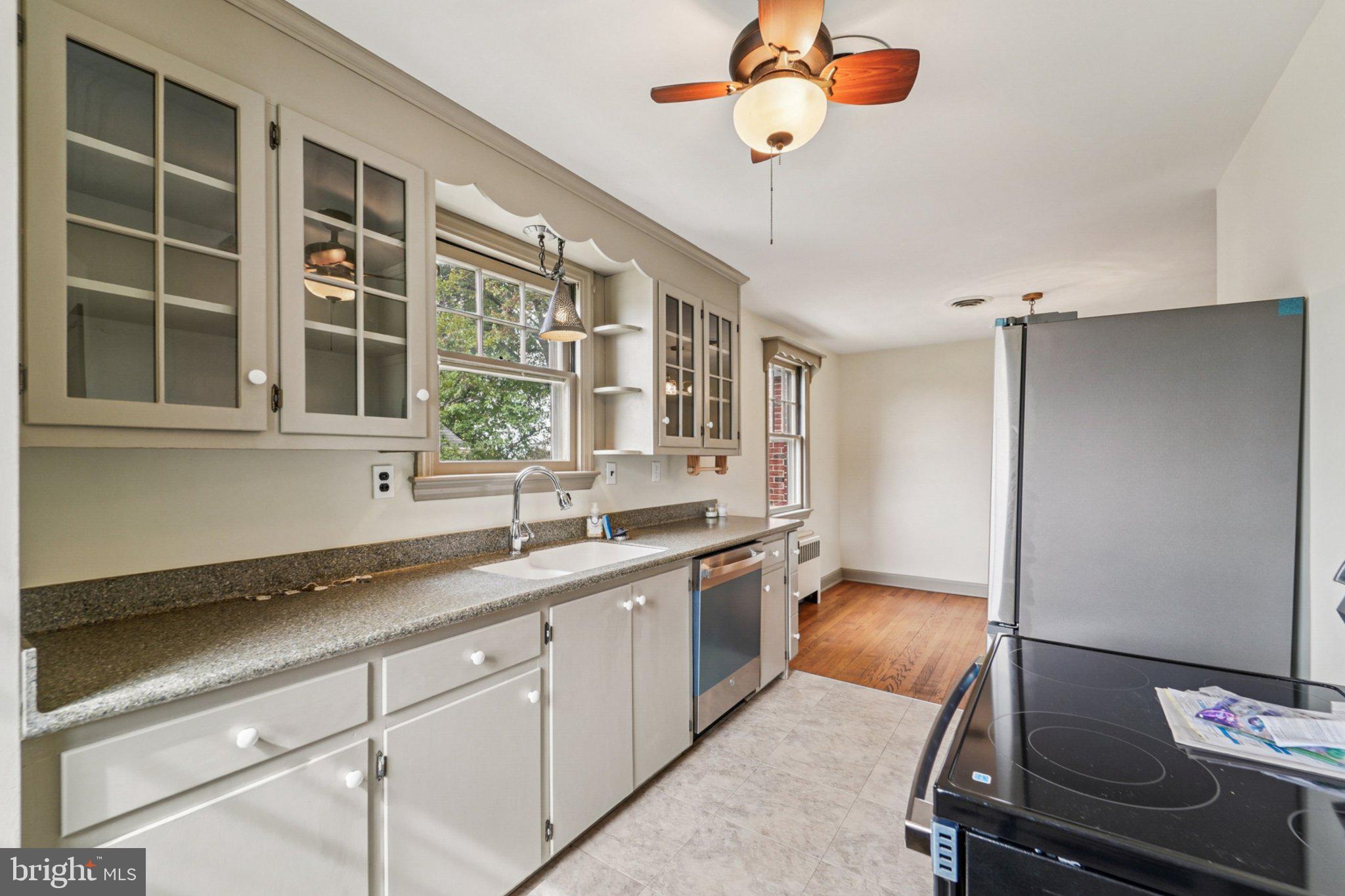 1008 North Main Street Mount Airy, MD 21771 - Photo 13 of 52 a kitchen with a refrigerator and a sink