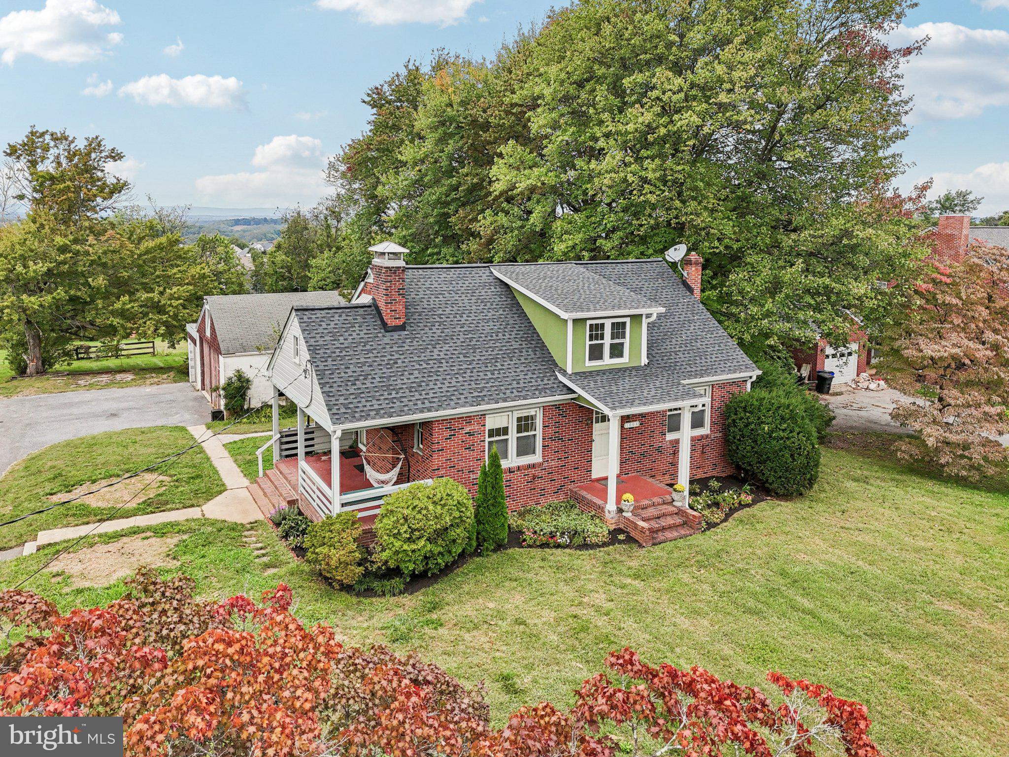 1008 North Main Street Mount Airy, MD 21771 - Photo 27 of 52 a front view of a house with garden