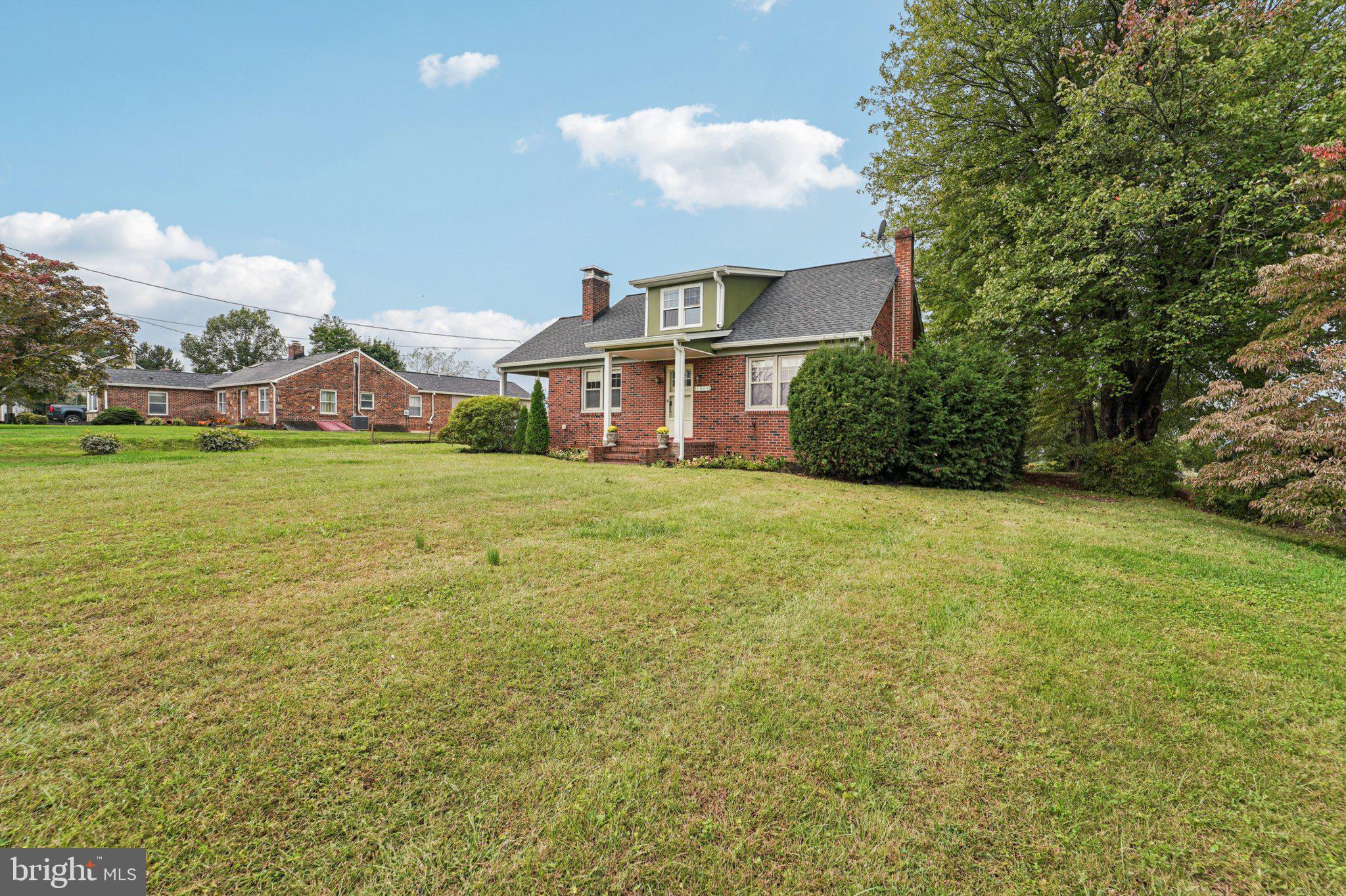 1008 North Main Street Mount Airy, MD 21771 - Photo 32 of 52 a view of a house with a big yard and large trees