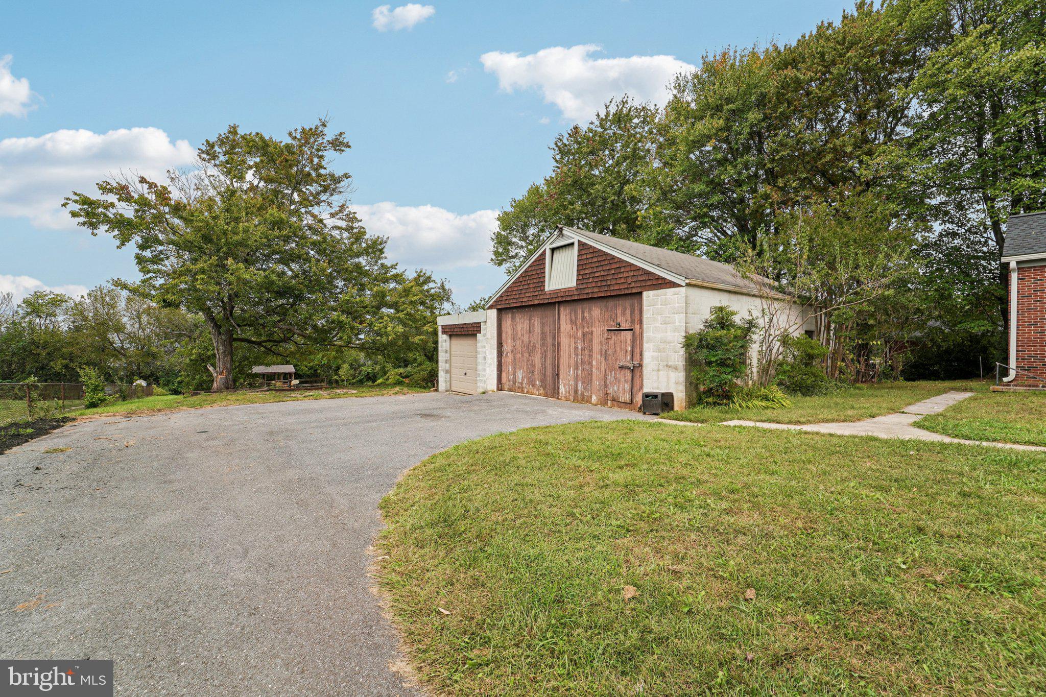 1008 North Main Street Mount Airy, MD 21771 - Photo 33 of 52 a view of a house with a yard and large trees