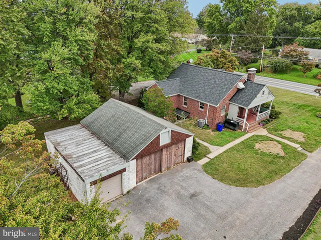 an aerial view of a house with a garden