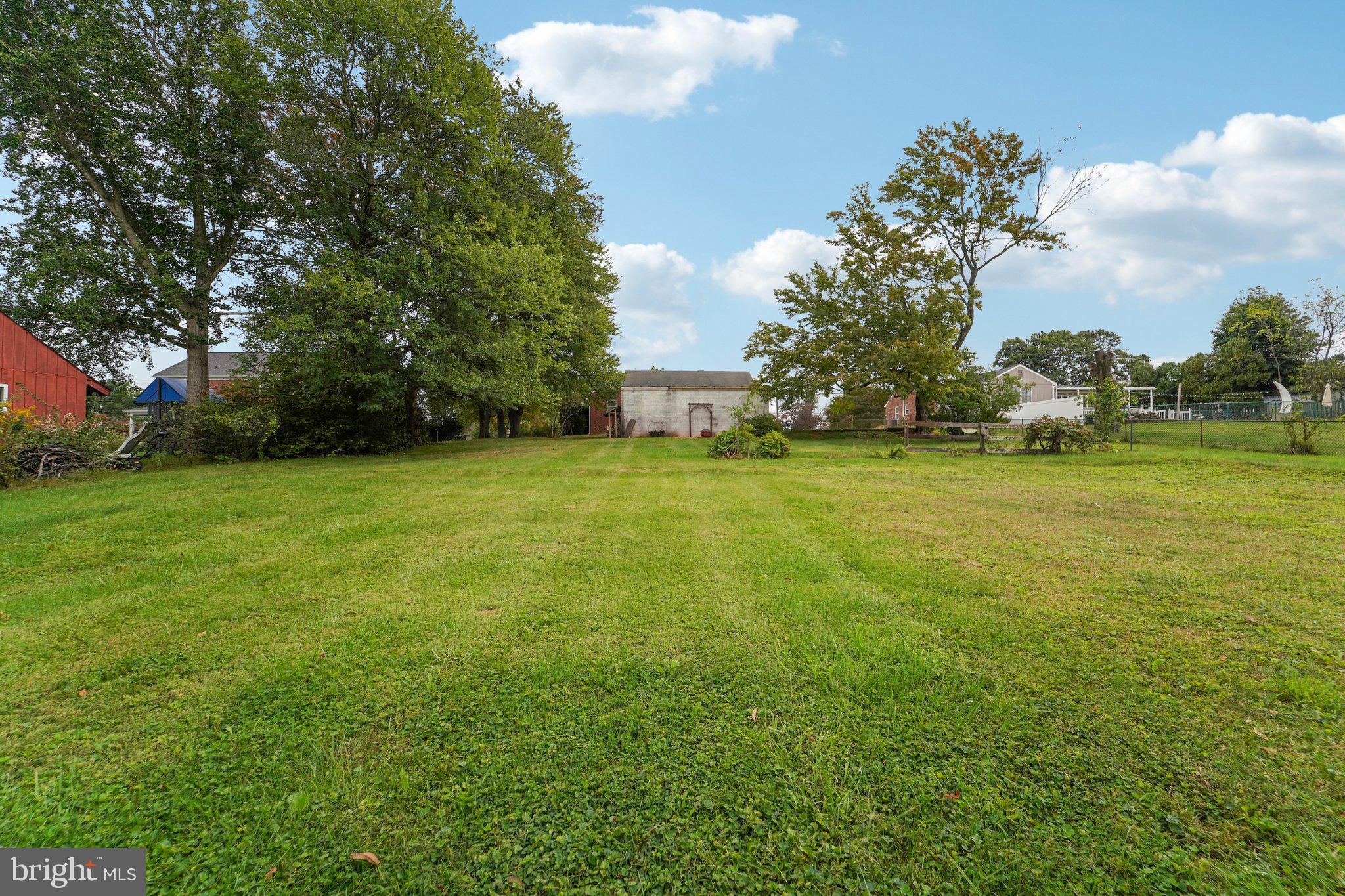 1008 North Main Street Mount Airy, MD 21771 - Photo 41 of 52 a view of a green field with wooden fence