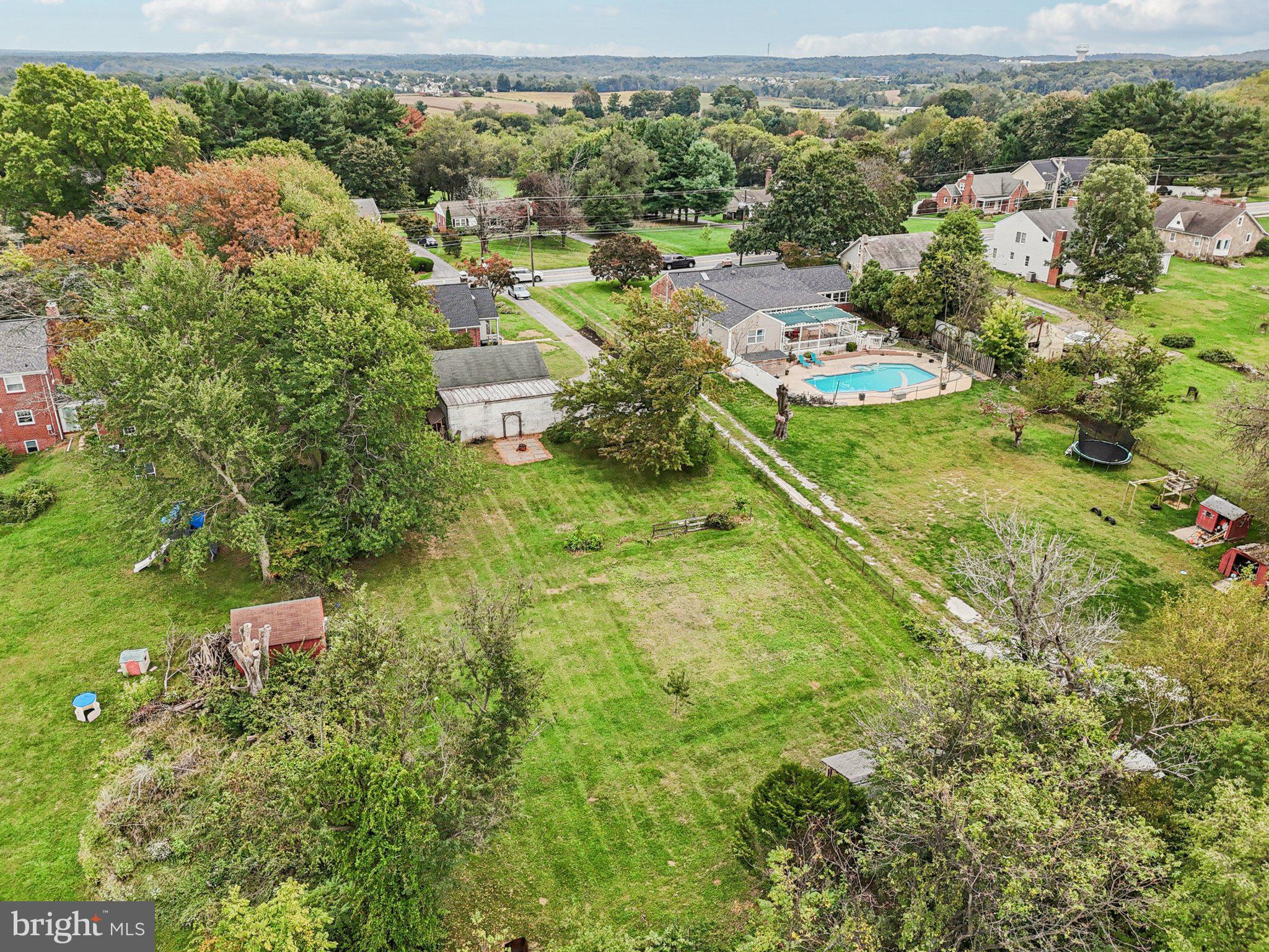 1008 North Main Street Mount Airy, MD 21771 - Photo 43 of 52 an aerial view of residential houses with outdoor space and trees