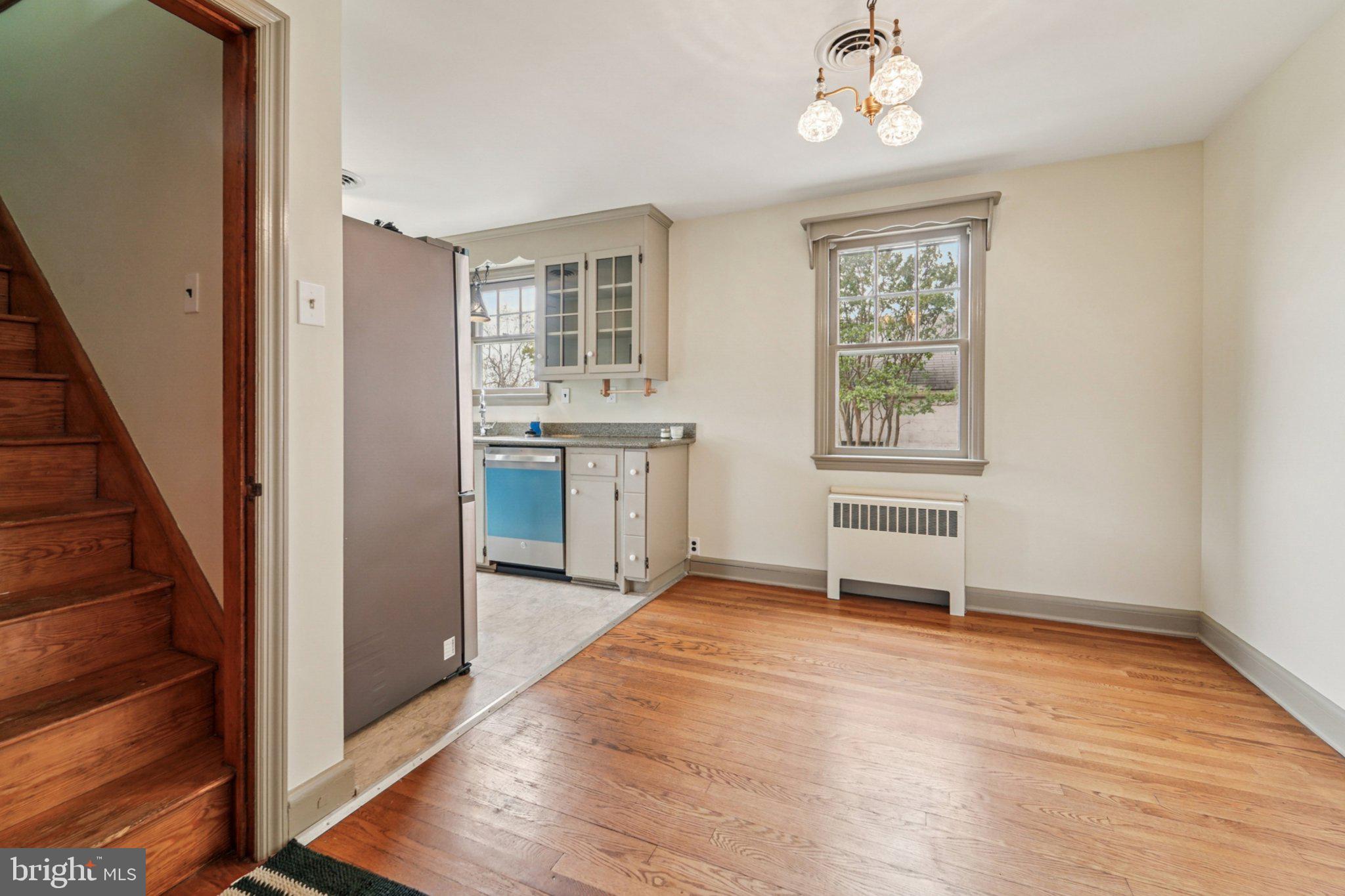 1008 North Main Street Mount Airy, MD 21771 - Photo 9 of 52 a view of an empty room with a window and wooden floor