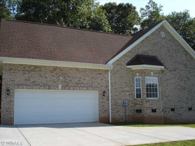 7405 Friendship Church Road Browns Summit, NC 27214 - Photo 3 of 12 Parking Lot/Garage. Side of home