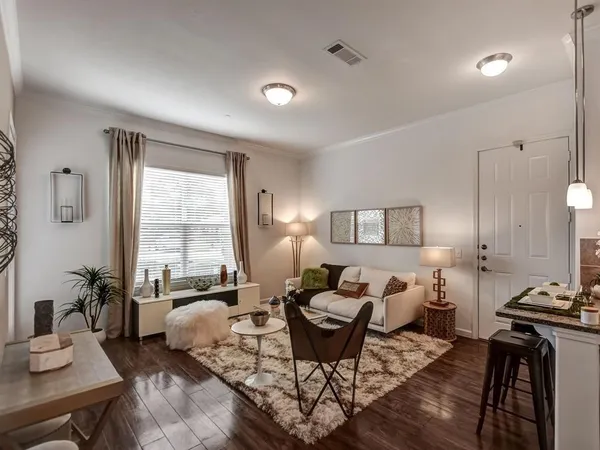 a living room with furniture or couch and a window