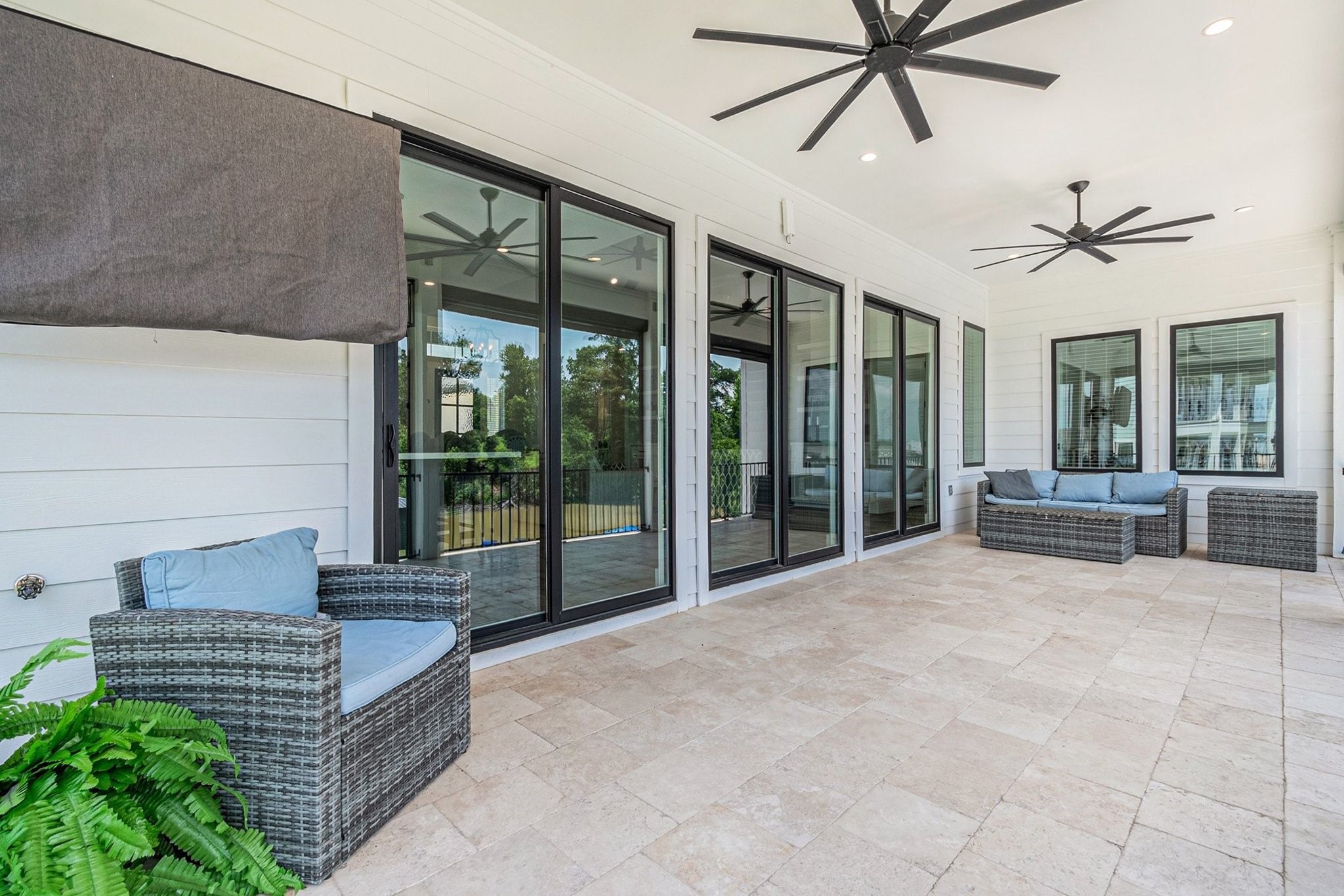 111 Seagull Path Point Blank, TX 77364 - Photo 14 of 50 Outside balcony with TV and 3 sliders.