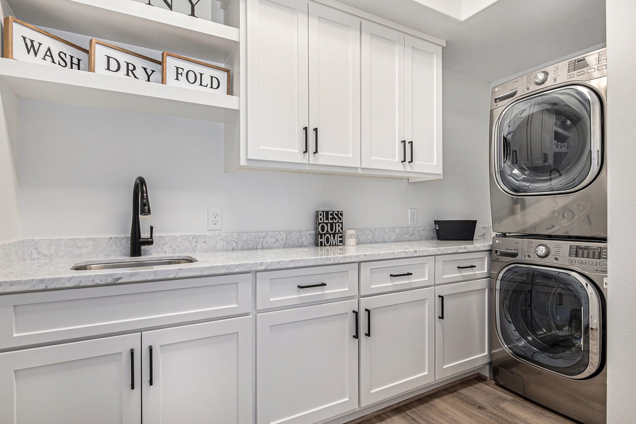 111 Seagull Path Point Blank, TX 77364 - Photo 29 of 50 Large laundry room with sink and storage.