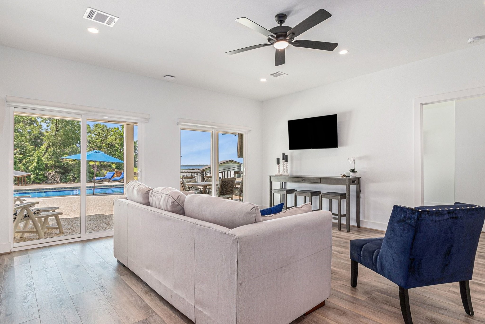 111 Seagull Path Point Blank, TX 77364 - Photo 31 of 50 These sliders lead out to the lower level deck and have nice pull down shades.