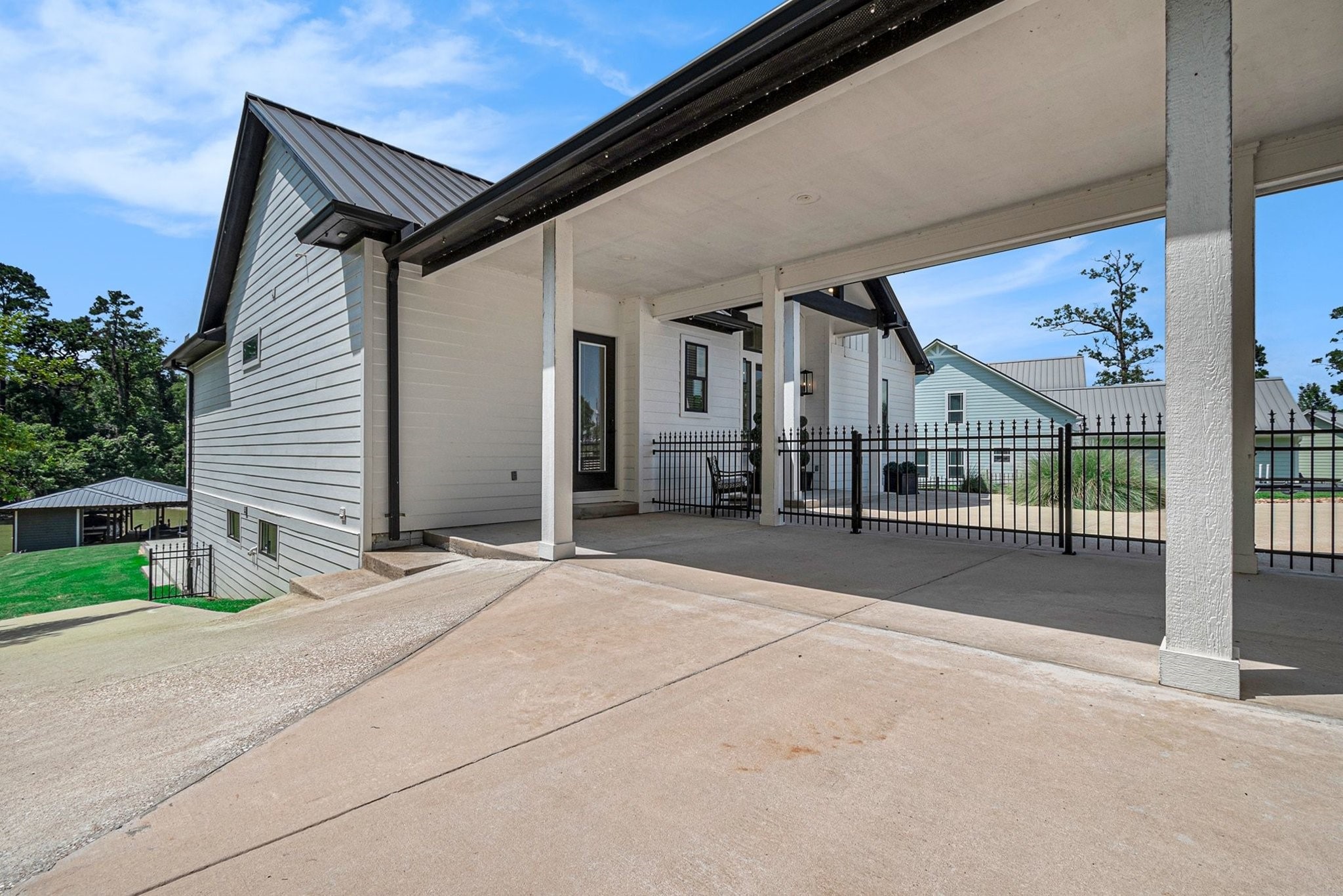 111 Seagull Path Point Blank, TX 77364 - Photo 5 of 50 Side entry door for guests that goes straight to the lower level. There is also a golf cart path to the left.