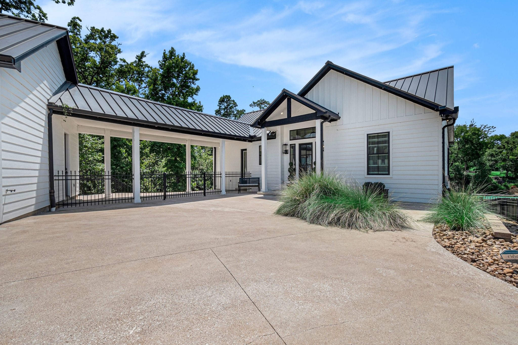 111 Seagull Path Point Blank, TX 77364 - Photo 7 of 49 a house with a yard and potted plants