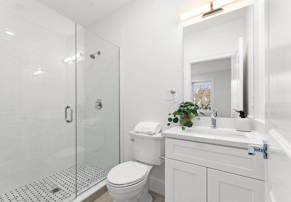 272 Lincoln Street, Unit 301 Marlborough, MA 01752 - Photo 18 of 30 a bathroom with a sink toilet and shower