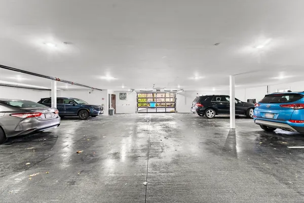 a view of parking with cars parked