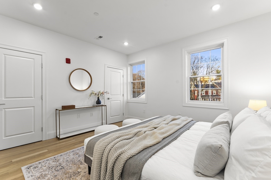 272 Lincoln Street, Unit 301 Marlborough, MA 01752 - Photo 23 of 30 a bedroom with a bed and window