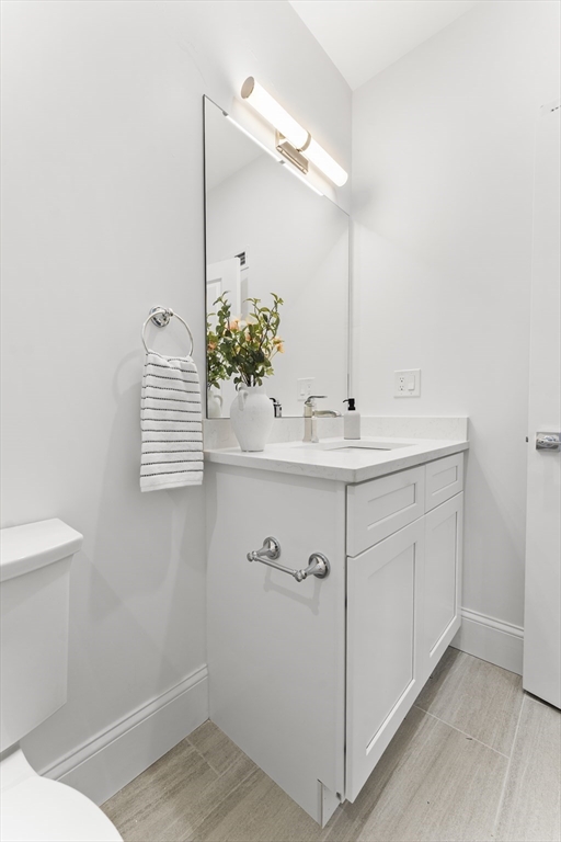 272 Lincoln Street, Unit 301 Marlborough, MA 01752 - Photo 26 of 30 a bathroom with a sink and a mirror