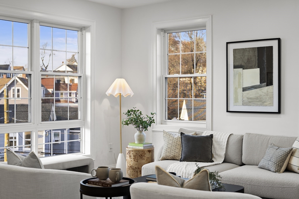 272 Lincoln Street, Unit 301 Marlborough, MA 01752 - Photo 3 of 30 a living room with furniture fireplace and a window