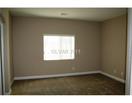 5899 Crumbling Ridge Street Henderson, NV 89011 - Photo 5 of 11 Master Bedroom. Downstairs master.