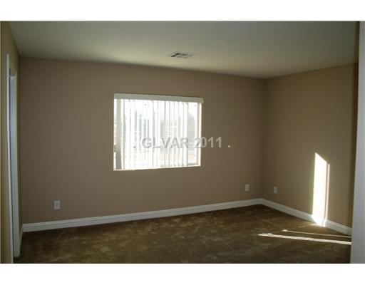 5899 Crumbling Ridge Street Henderson, NV 89011 - Photo 8 of 11 Master Bedroom. Upstairs master sized bedroom