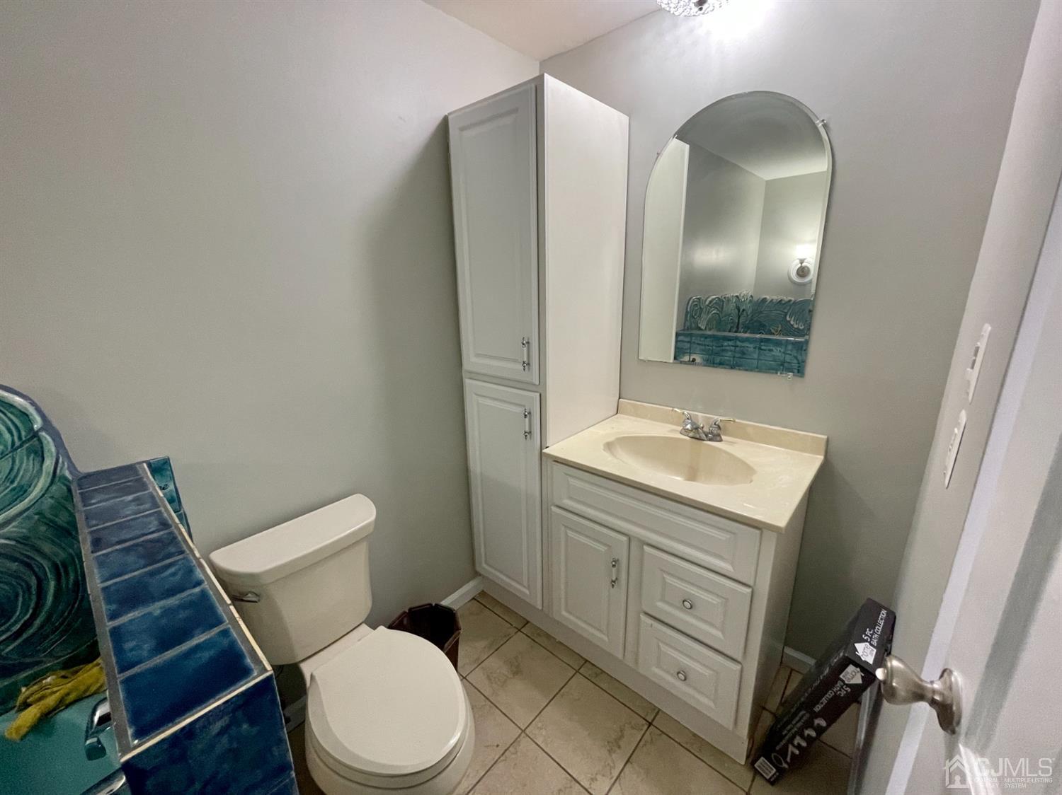 43 Hunt Road Somerset, NJ 08873 - Photo 12 of 21 a bathroom with a toilet a sink and mirror