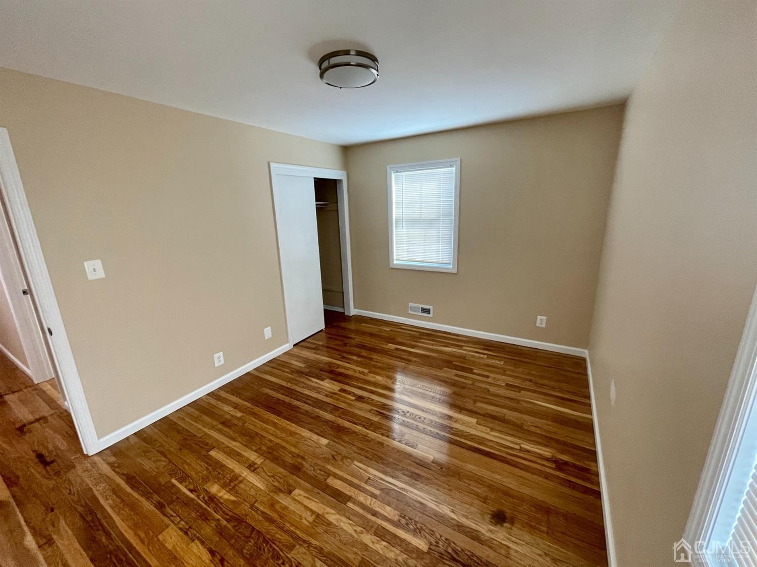 43 Hunt Road Somerset, NJ 08873 - Photo 14 of 21 a view of room with window and hardwood floor