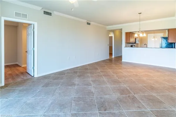 a view of a kitchen with a sink and a window