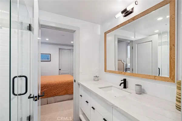 a bathroom with a double vanity sink and mirror