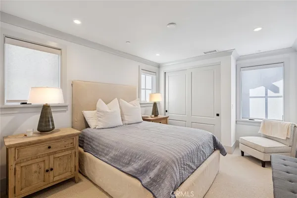 a bedroom with a large bed and furniture