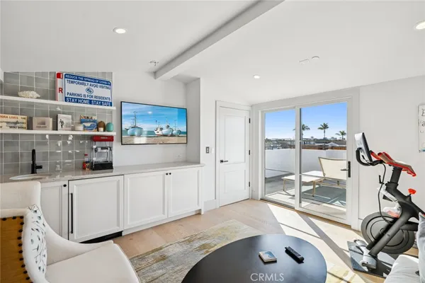 a kitchen with stainless steel appliances kitchen island granite countertop a refrigerator and cabinets