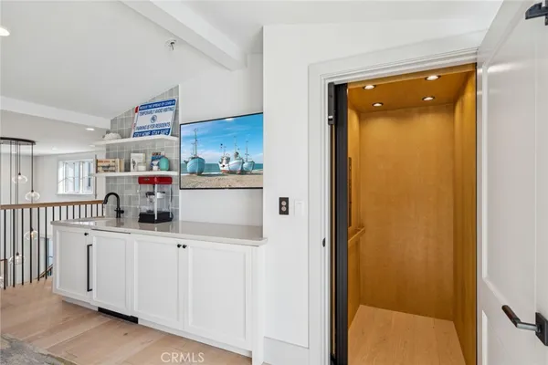 a kitchen with stainless steel appliances a refrigerator and a cabinets