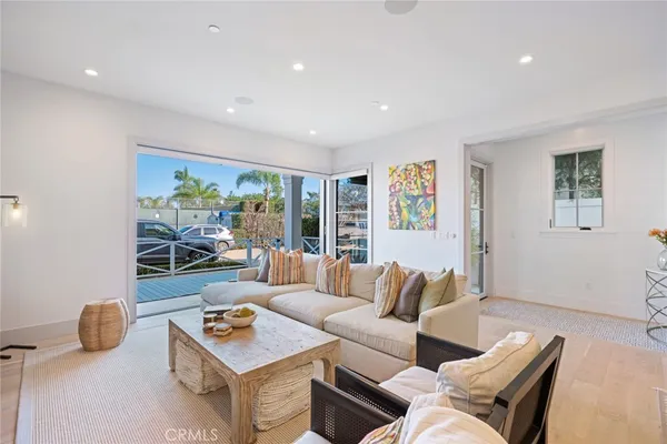 a living room with furniture rug and window