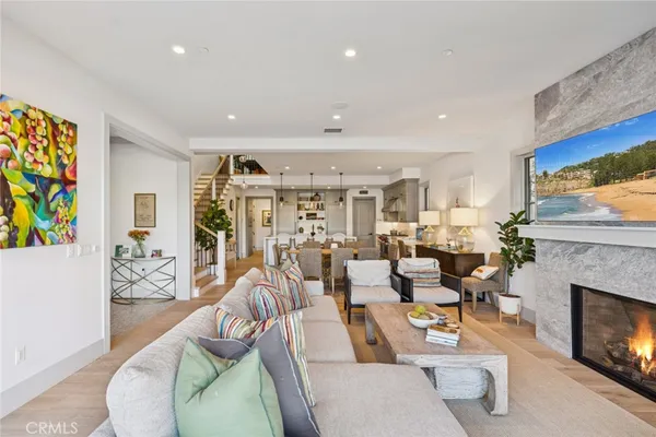 a living room with patio fireplace furniture and a fireplace